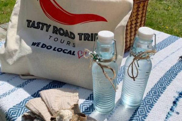 tasty road trips handbag and basket outdoors next to a river 1