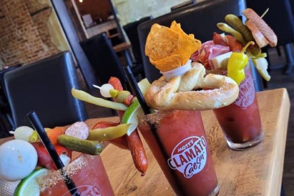 three food cocktails on a wooden table